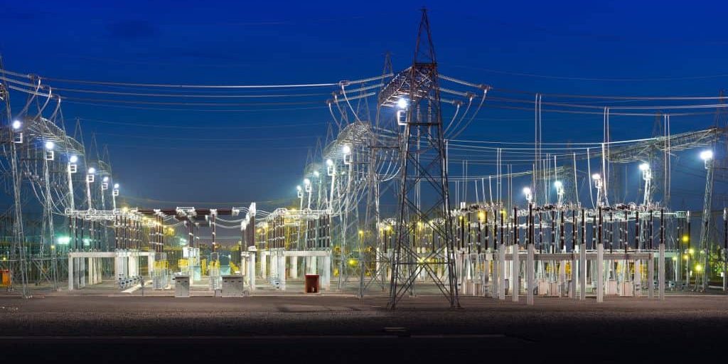 View of an electric substation at night